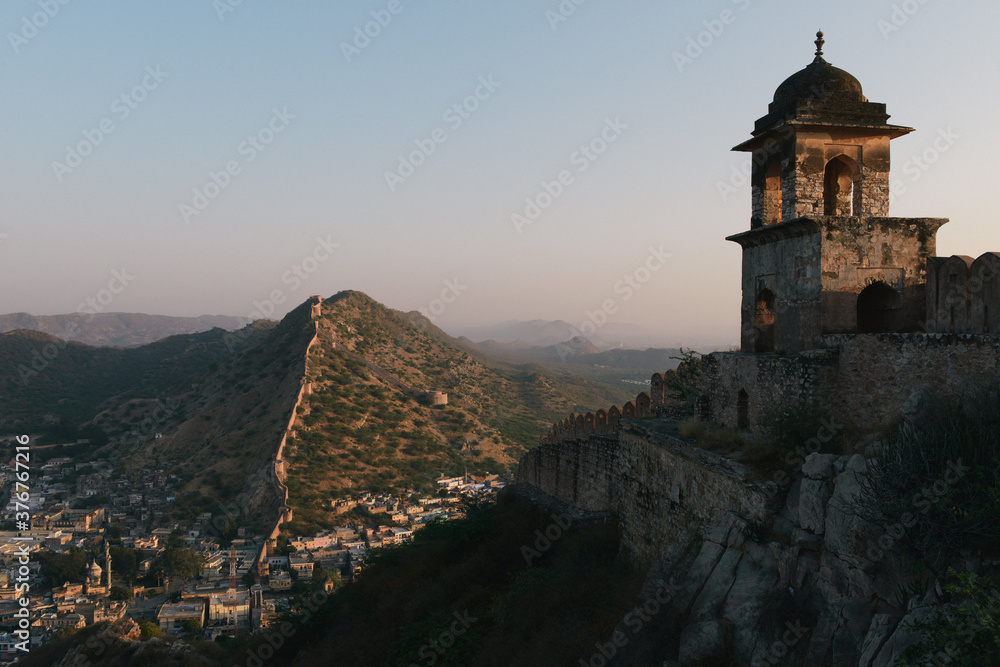 Elevated view of city wall and tower at sunrise, Amer Fort, Jaipur, Rajasthan, India Elevated view of city wall and tower at sunrise, Amer Fort, Jaipur, Rajasthan, India