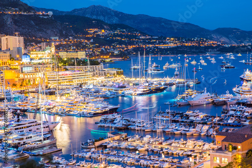 Elevated view of superyachts at Monaco yacht show at dusk photo
