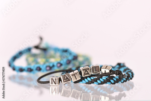 Homemade friendship bracelet and bracelet with letters, Natali.