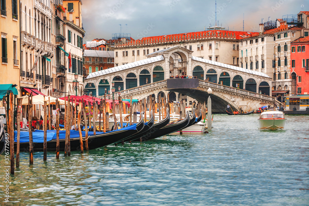 Venetian cityscape with Rialto Bridge and Grand Canal. Venice, Italy