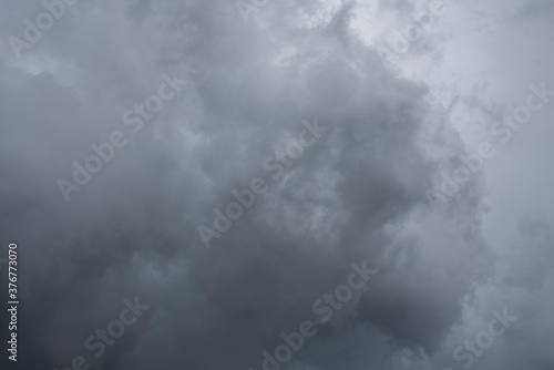 dark Cumulus clouds gathered in clouds