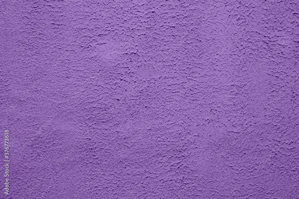 Fototapeta premium Purple wall with cracked paint surface. Grunge background or texture.