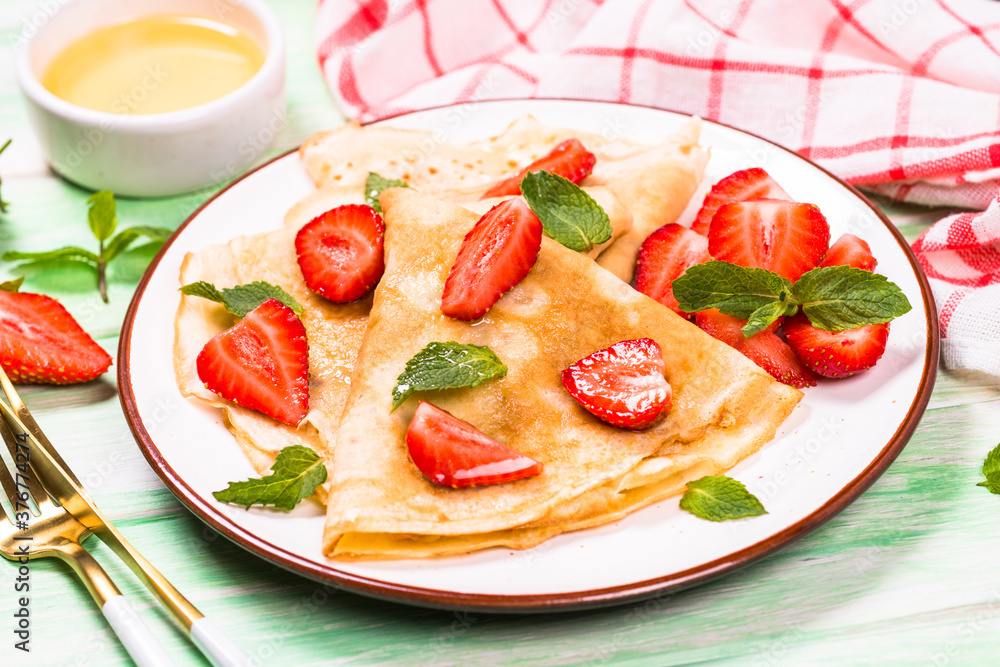 Crepes with fresh srawberries and honey. Crepes with fresh srawberries and honey.