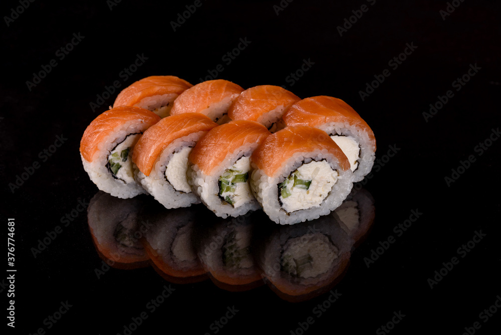 Fresh sushi rolls prepared from the best varieties of fish and seafood Fresh sushi rolls prepared from the best varieties of fish and seafood