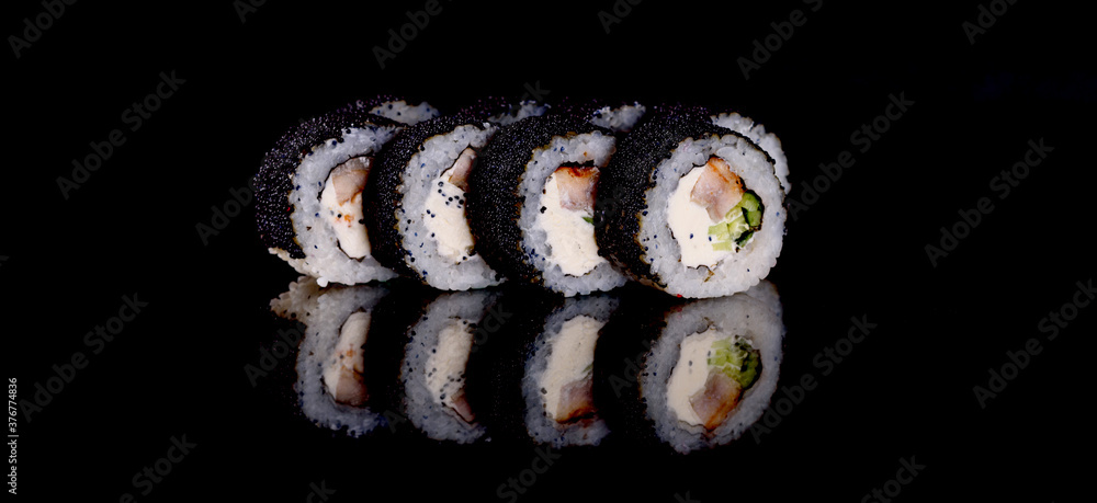 Fresh sushi rolls prepared from the best varieties of fish and seafood Fresh sushi rolls prepared from the best varieties of fish and seafood