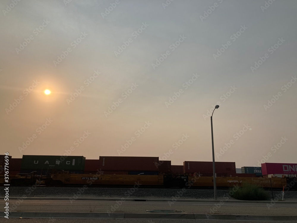 Fototapeta premium freight train yard at sunset