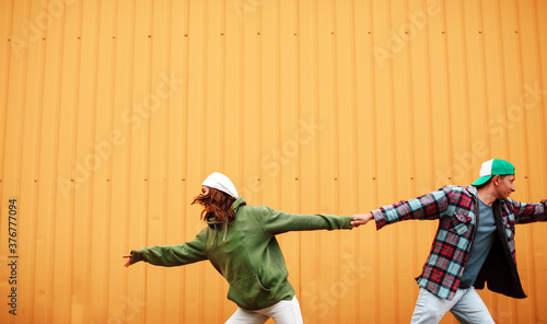 Young Couple in love. Couple in love. Wall background. Happy day. Crazy photo. Romantic. 
