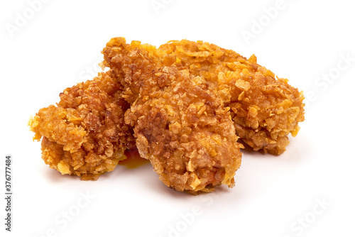 Fried chicken strips in breadcrumbs, isolated on white background