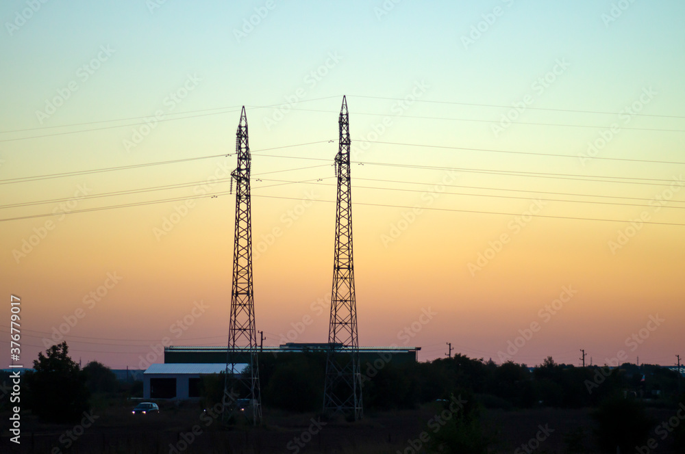 Electric poles against the sunset Electric poles against the sunset