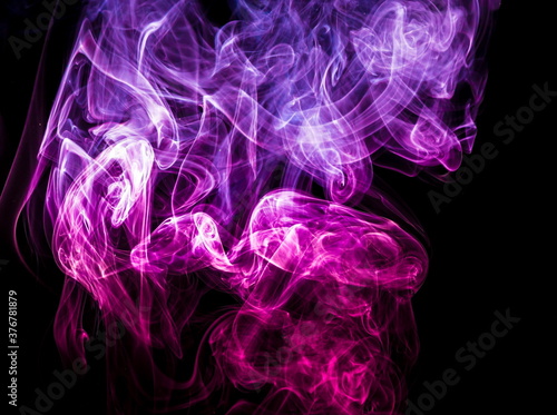 Colored smoke on black background