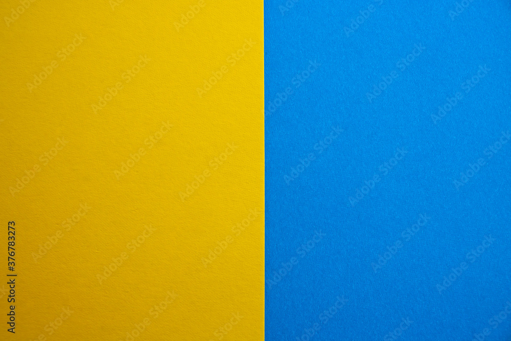 Blue-yellow background of matte suede, close-up. Velvety texture Blue-yellow background of matte suede, close-up. Velvety texture