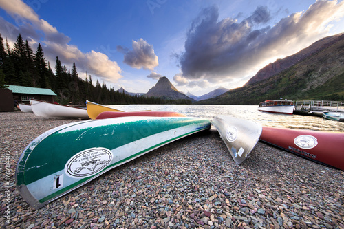 Canoes on shore of Two Medicine Lake in Glacier National Park photo