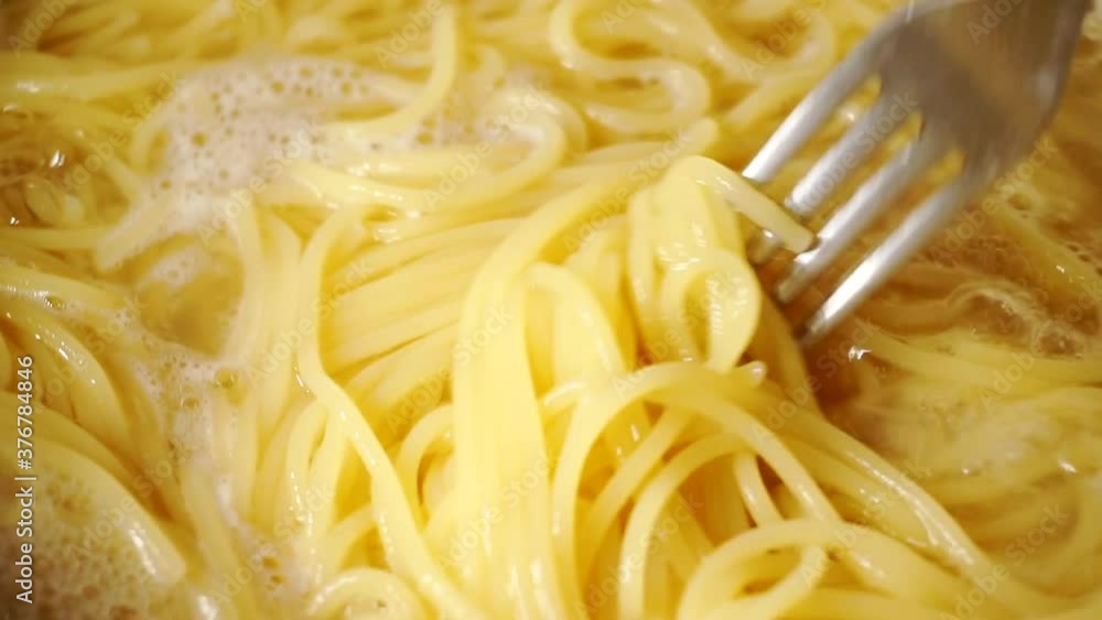 Close-up of spaghetti pasta In boiling hot water. Close-up of spaghetti pasta In boiling hot water.