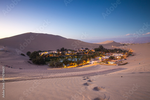 View of village in desert oasis photo