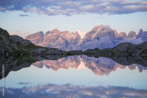 sunset at the black lake with the Brenta Dolomites in the background