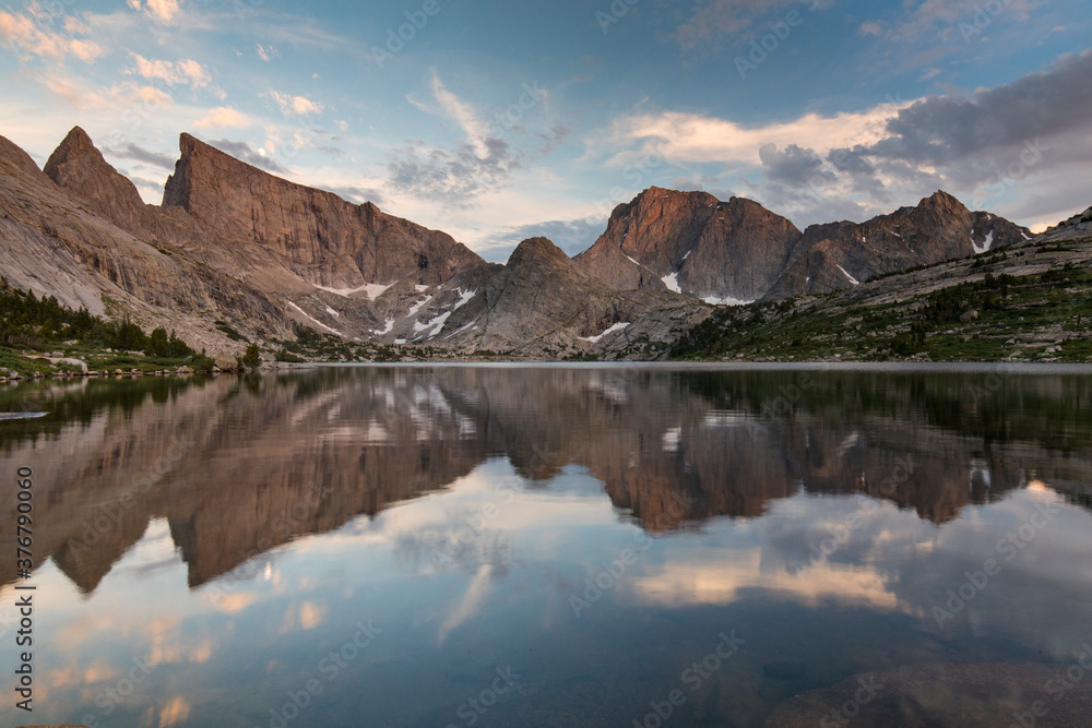 View of Deep Lake with mountain range during sunset View of Deep Lake with mountain range during sunset