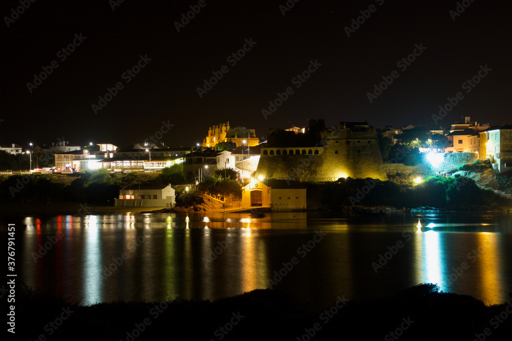 Night view of Vila Nova de Milfontes, Portugal, from the south bank to the north bank.