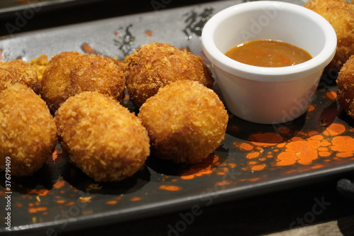 croquettes with deep sweet sauce. traditional spanish food