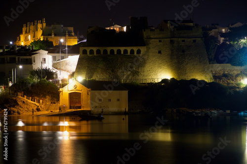 Night view of Vila Nova de Milfontes, Portugal, from the south bank to the north bank.