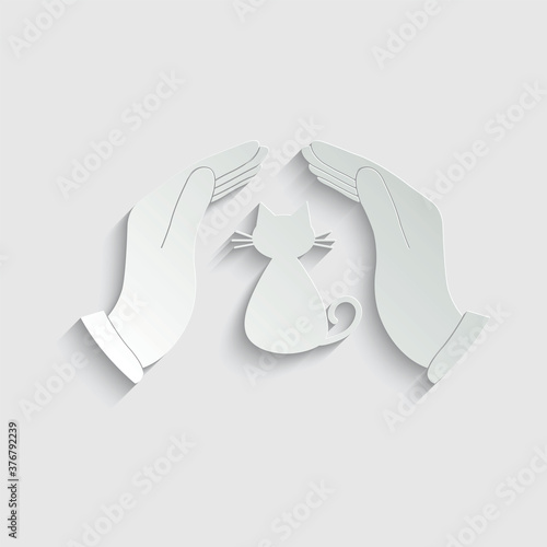 paper cat care icon. the hand  is holding a cat vector icon veterinary