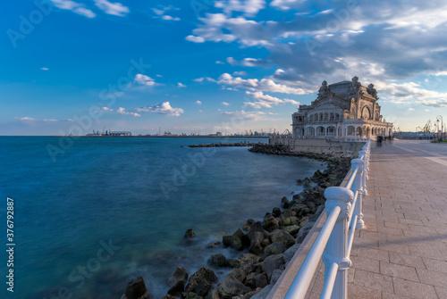 View of Constanta Casino against cloudy sky photo