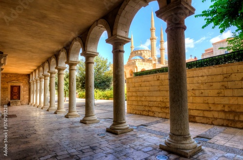 View of Mohammad Al Amin Mosque seen through pillars of Saint George Greek Orthodox Cathedral