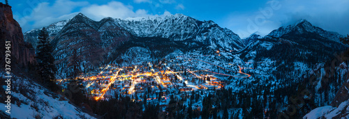 Scenic view of Ouray town against mountain range at dusk photo