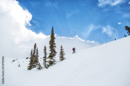 Skier walking up on mountain in Kokanee Glacier Provincial Park photo
