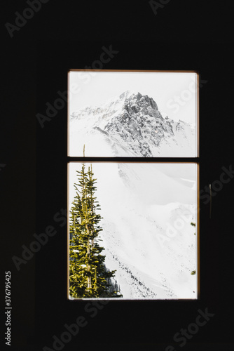 Scenic view of mountain seen through opus hut window