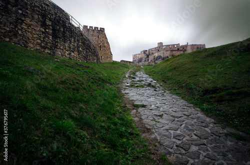 View of Spis Castle against cloudy sky photo