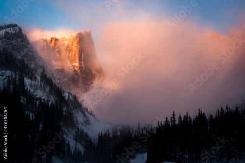 Scenic view of mist covered Hallett Peak during sunrise
