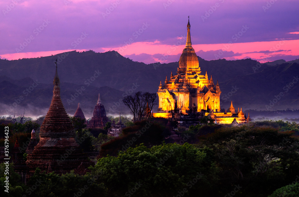 Scenic view of temples amidst trees during sunset Scenic view of temples amidst trees during sunset