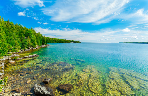  beautiful gorgeous inviting view of Bruce Peninsula park landscape, grounds with its tranquil, turquoise clean water on sunny summer beautiful day