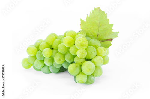 Bunch of fresh green grape with leaf isolated on white background, clipping path. Green fruit concept