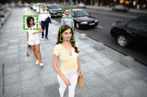 Facial recognition system identifying people on city street © New Africa