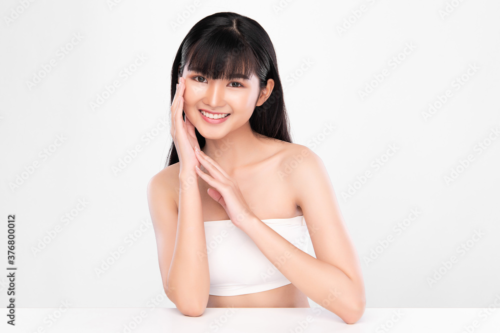 Beautiful Young asian Woman with Clean Fresh Skin on white background, Face care, Facial treatment, Cosmetology, beauty and spa, Asian women portrait Beautiful Young asian Woman with Clean Fresh Skin on white background, Face care, Facial treatment, Cosmetology, beauty and spa, Asian women portrait