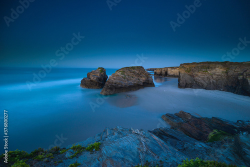 sunset at the Catedrales or Augas Santas beach, in Ribadeo. Lugo, Galicia photo