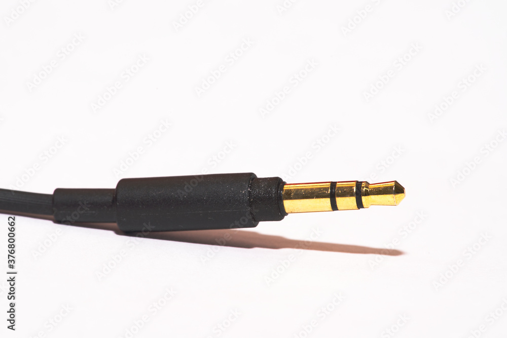 Fototapeta premium audio cable with 3.5 mm jack isolated on white