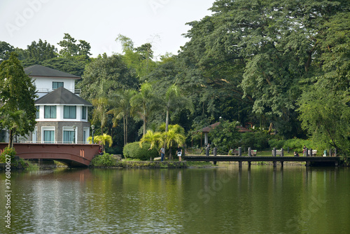 Ninoy Aquino parks and wildlife water lagoon plus house facade in Quezon City, Philippines