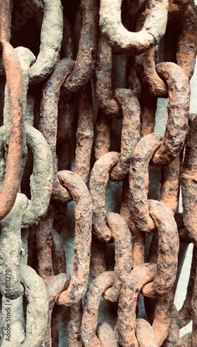 Rusty textured big metal chains different size rings photo