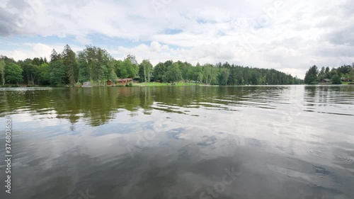 Movement over the surface of a lake in forest  photo