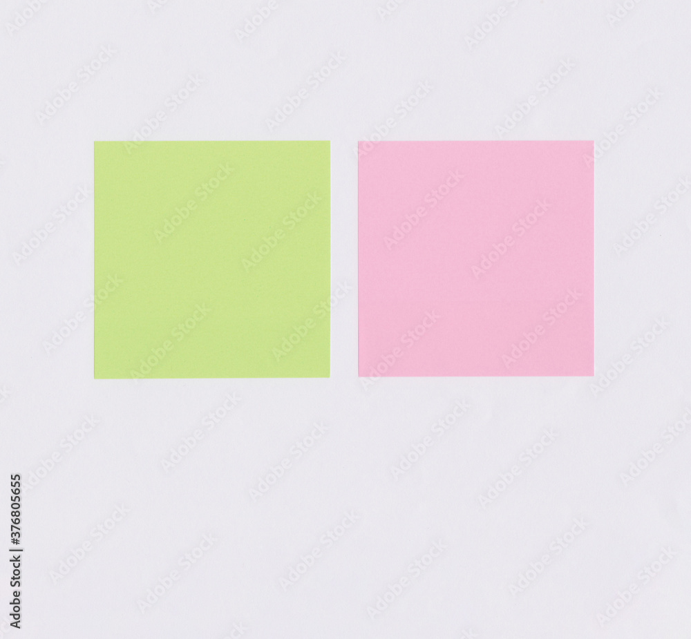 Colorful square note paper on white paper background.