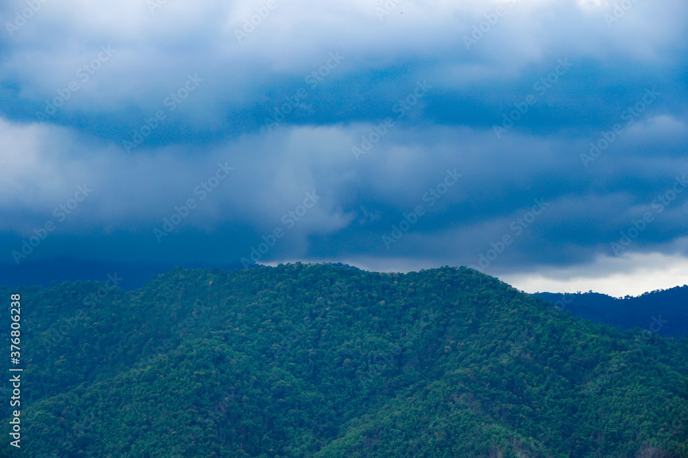 thunderstorm over green slope, cloudy dark summer tropical landscape, background, wallpaper
