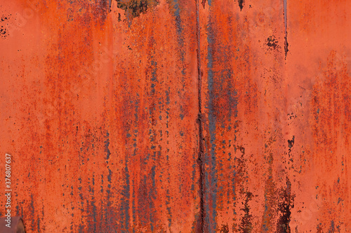 Red Paint and Rust on Metal Background