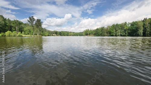 Movement over the surface of a lake in forest  photo