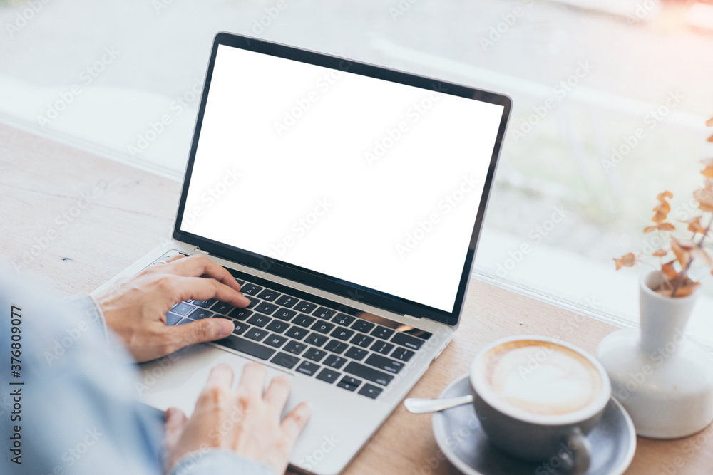 computer mockup blank screen.hand woman work using laptop with white background for advertising,contact business search information on desk at coffee shop.marketing and creative design computer mockup blank screen.hand woman work using laptop with white background for advertising,contact business search information on desk at coffee shop.marketing and creative design