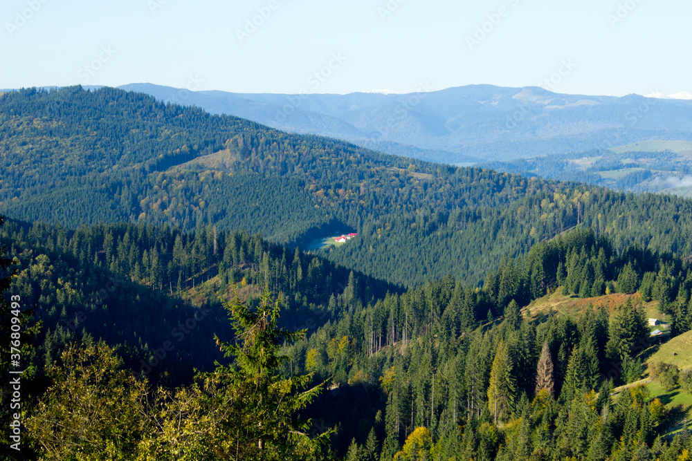 Beautiful morning landscape on the way to Transfagarasan road with forest in Romania, Carpathian mountains in autumn,aerial view from the top on valley,image for calendar,poster,cover design,postcard