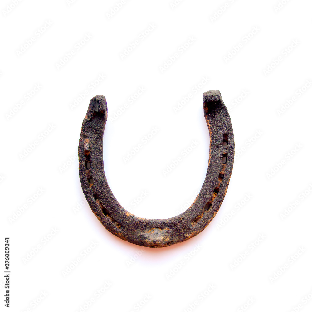 Old used rusty horseshoe isolated on white. Lucky symbol. St. Patrick's Day. Old used rusty horseshoe isolated on white. Lucky symbol. St. Patrick's Day.