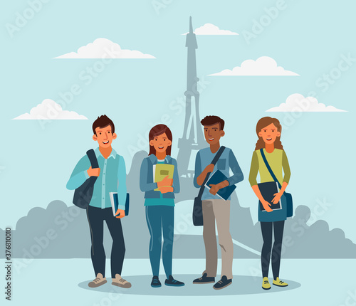 Happy and smiling group of students standing with notebooks in Paris with the Eiffel Tower in the background