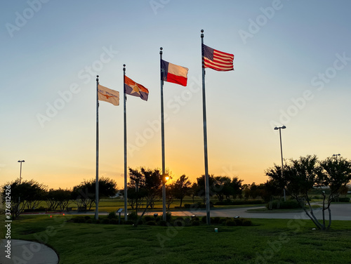 American and Texas flags in DFW Founders' Plaza